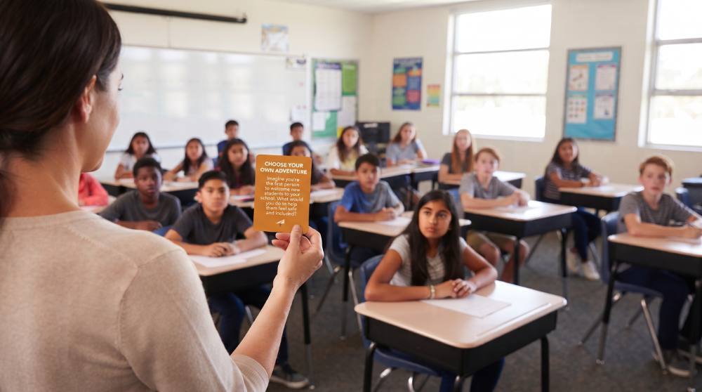 Teacher holding up a card for a class